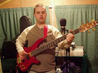 Phil playing bass in the studio
